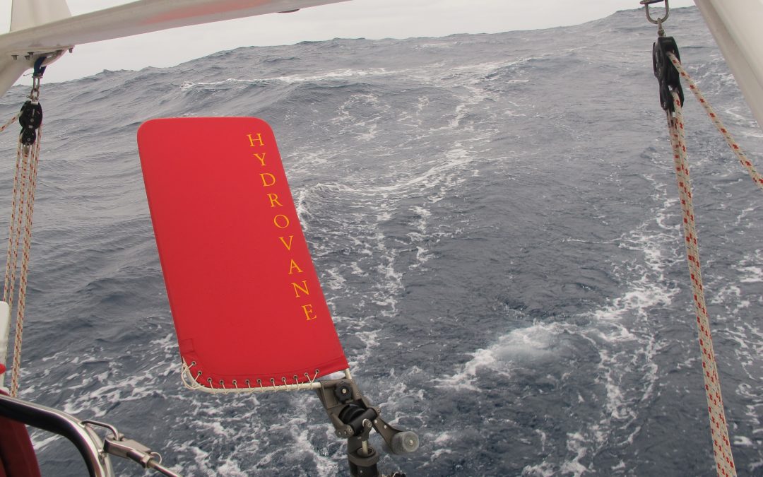'Jane' steering on a broad reach in big seas